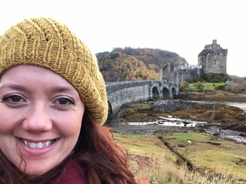 Women in front of Eileen Donan Castle, Scotland