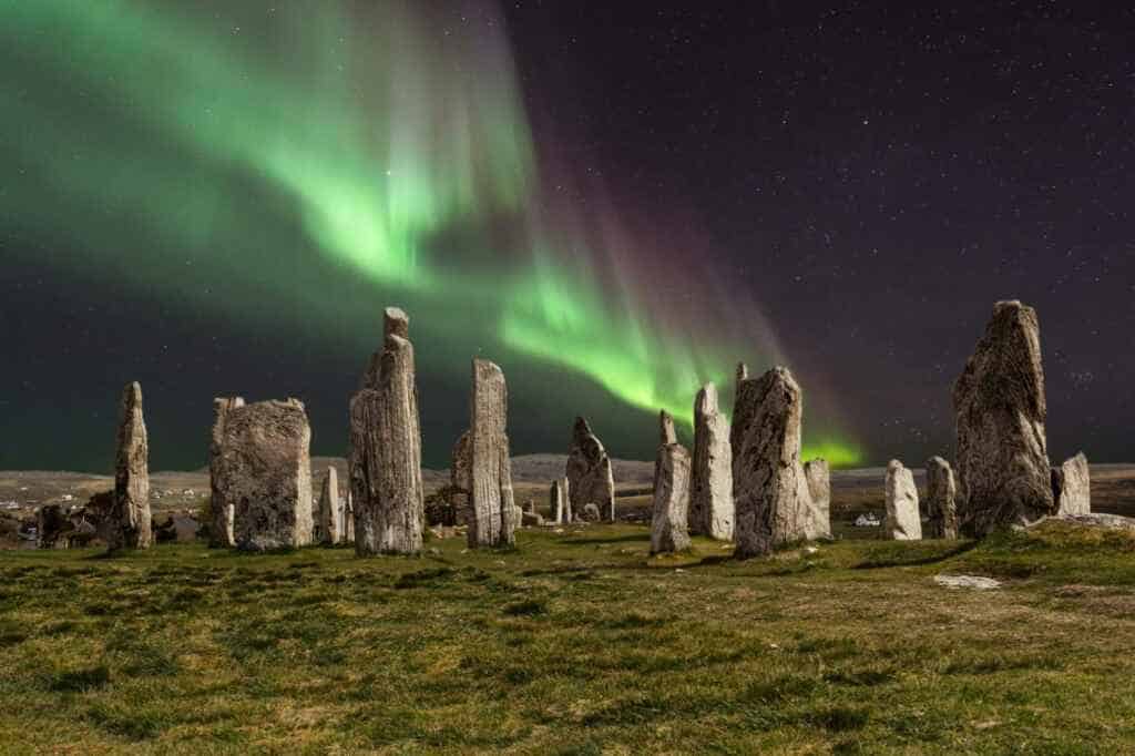 The Callanish Stones with the northern lights over them for "Can you see the Northern Lights in Scotland?"