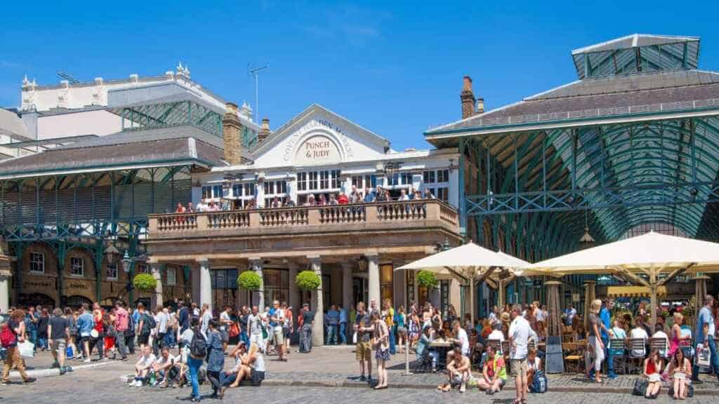 LONDON, UK - 22 JULY, 2014: Covent Garden market, one of the main tourist attractions in London, known as restaurants, pubs, market stalls, shops and public entertaining