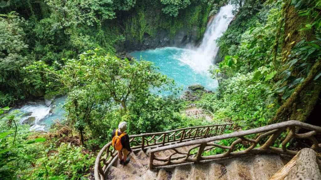 Majestic waterfall in the rainforest jungle of Costa Rica. Tropical hike.