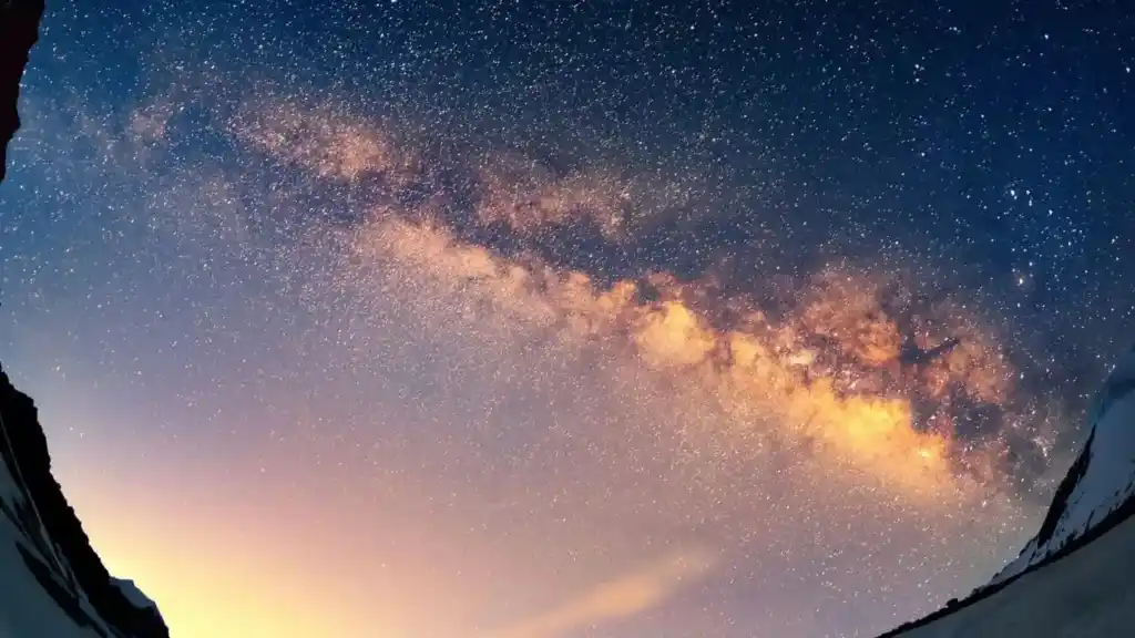Starry sky with people holding hands in silhouette