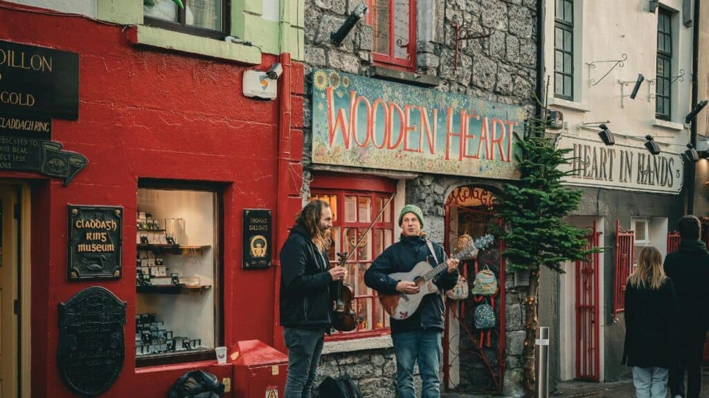 Two Men Playing Instruments on a Street in Galway