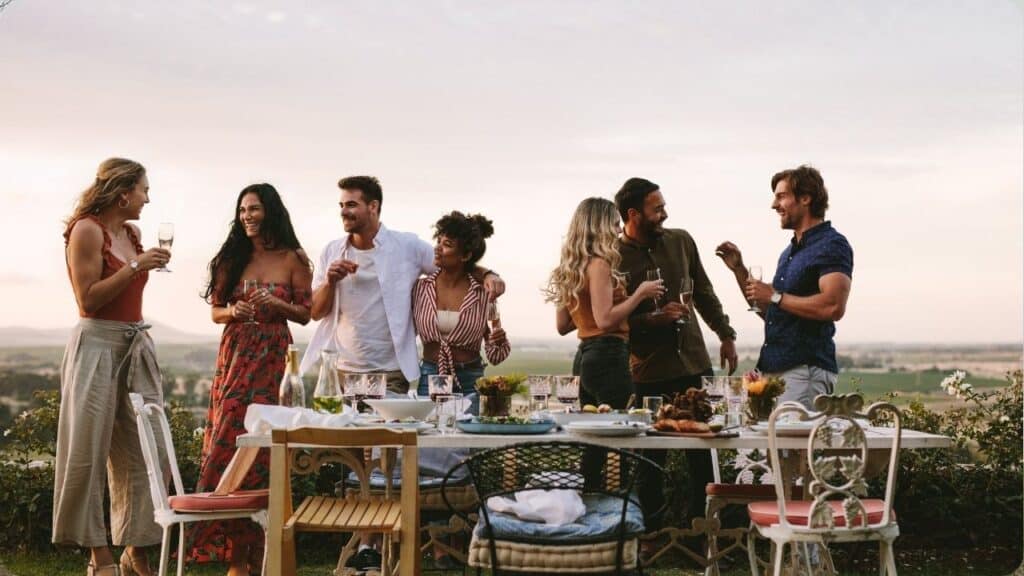 Millennials Enjoying Dinner Party Outdoors