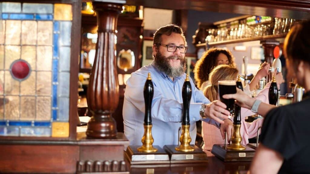 Someone ordering at a British pub