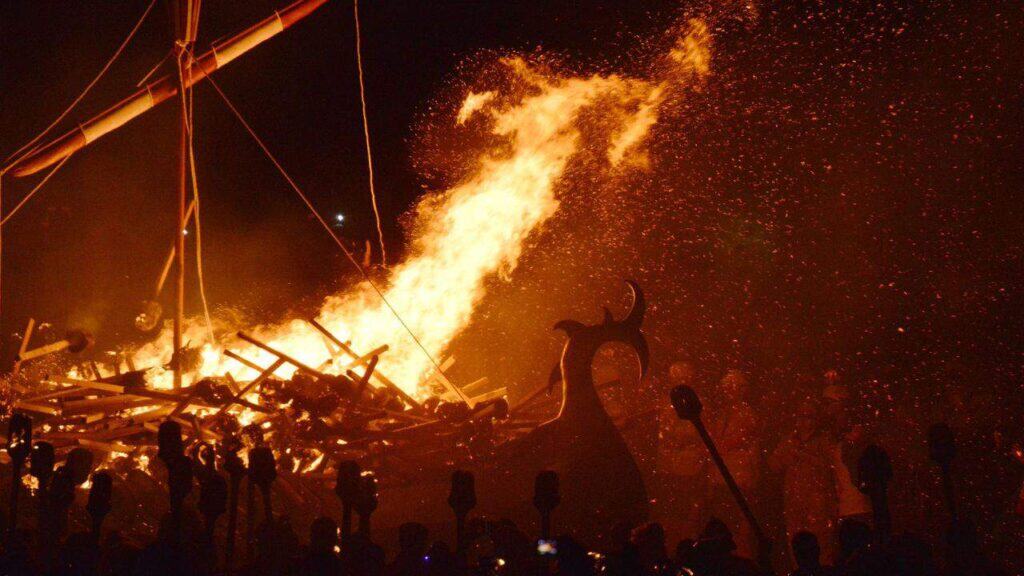 Viking ship on fire during the fire festival in Shetland, Scotland.