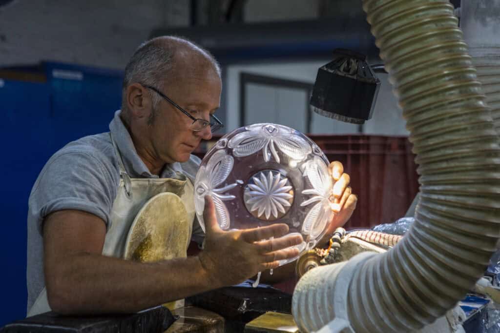 Waterford, Republic of Ireland - August 15th 2018: A craftsman working in the Sculpting Department at the Waterford Crystal factory, in the city of Waterford, Republic of Ireland.